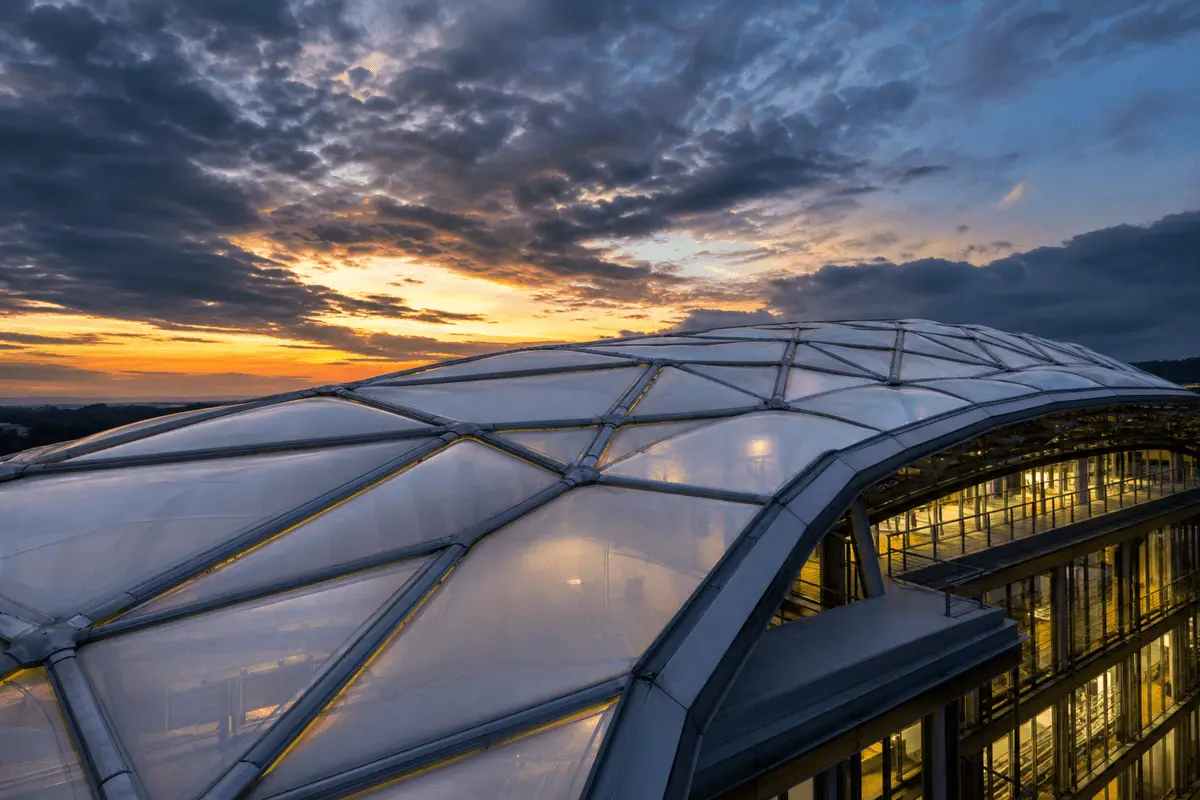 ETFE commercial roof under storm lighting and rain — Commercial Building ETFE Roofing