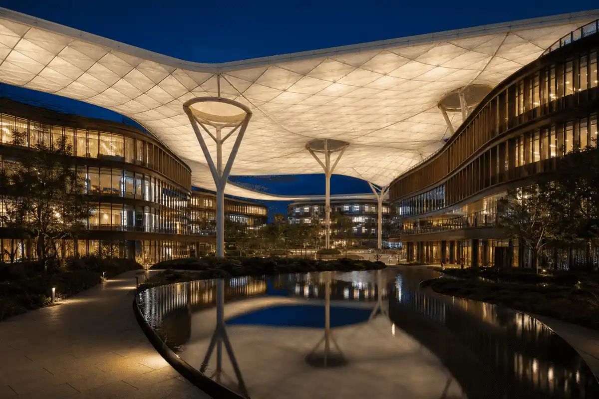 Night view of commercial building softly glowing through ETFE — Commercial Building ETFE Roofing systems