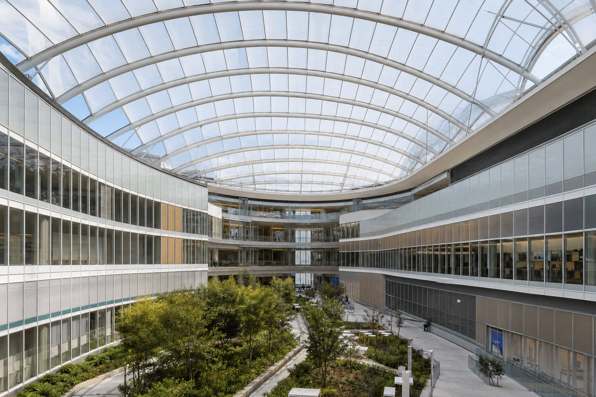 Hospital courtyard interior with sweeping ETFE skylight roof