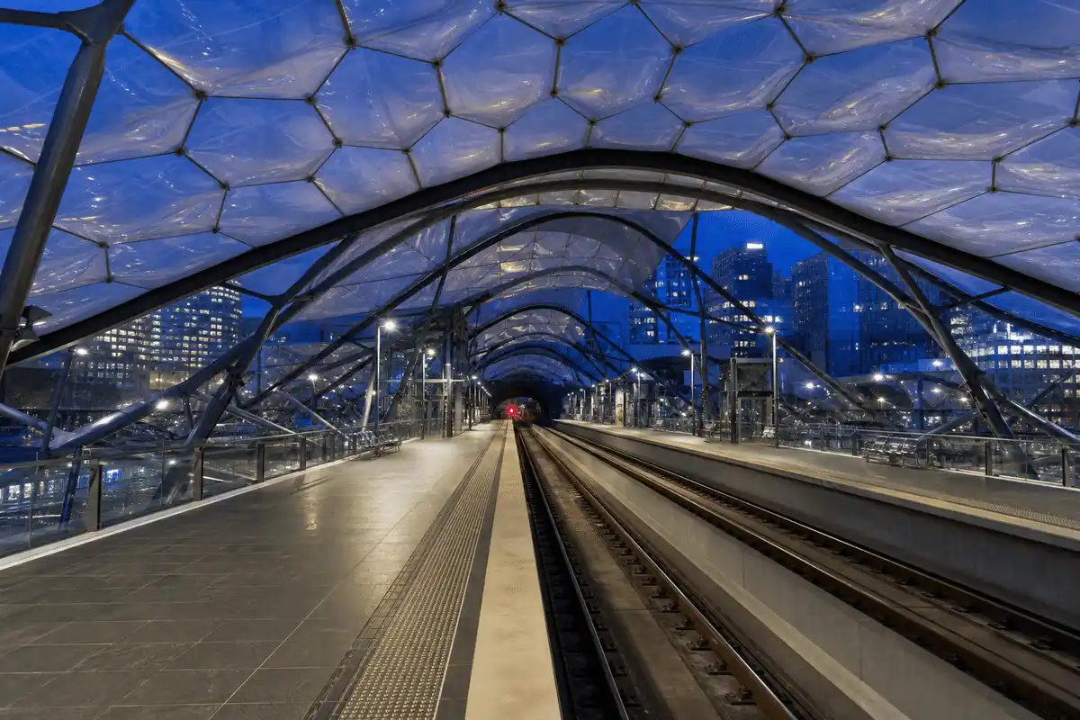 Night view of metro station softly glowing through ETFE roof — Metro Station ETFE Roofing systems