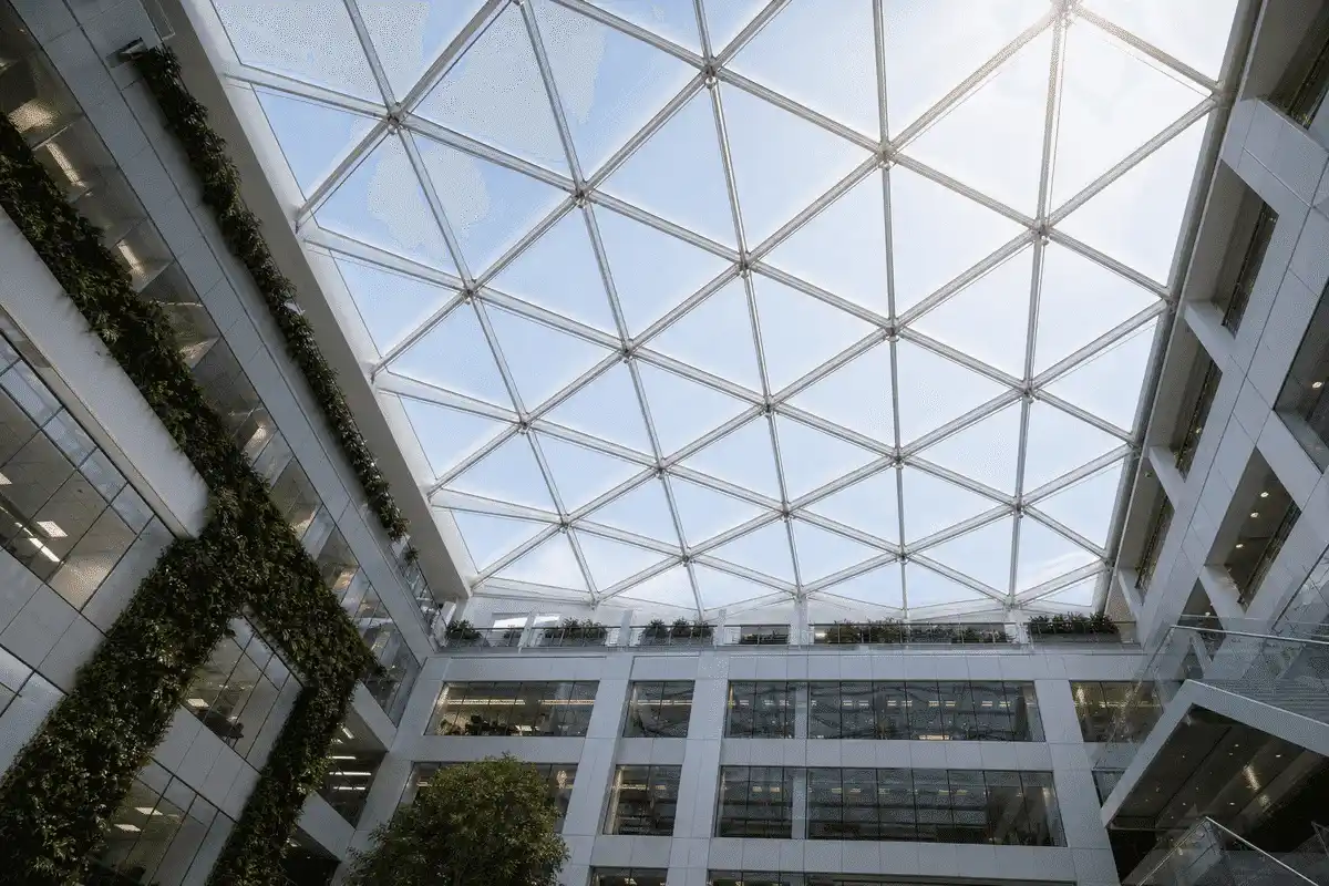 Office interior looking up at a daylit ETFE cushion roof — Office Building ETFE Roofing systems