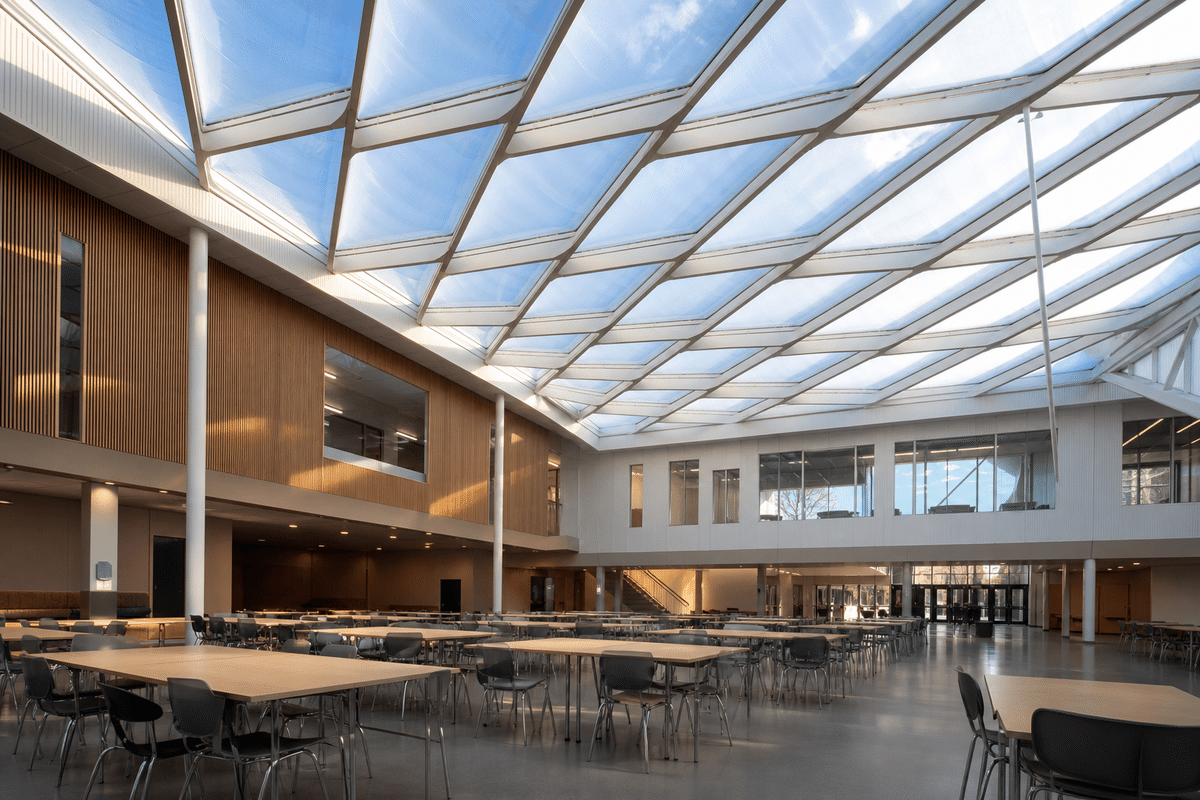 Natural daylight washing a school assembly hall through an ETFE roof