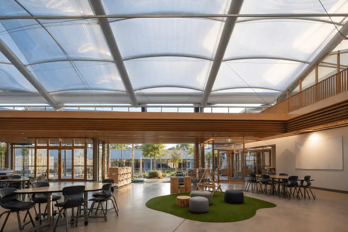 Interior looking up at a daylit ETFE cushion roof in a modern school with ETFE roof — School ETFE Roofing systems