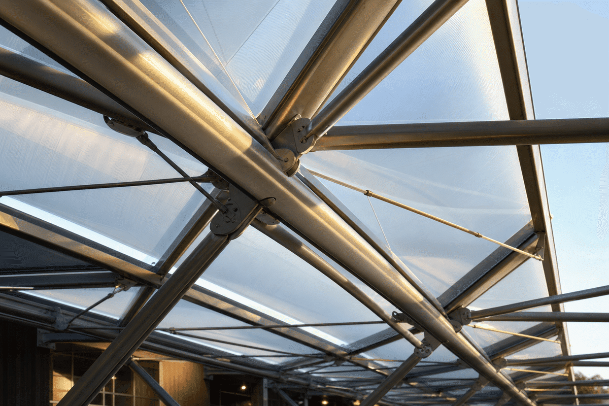 Steel grid structure supporting ETFE roof cushions