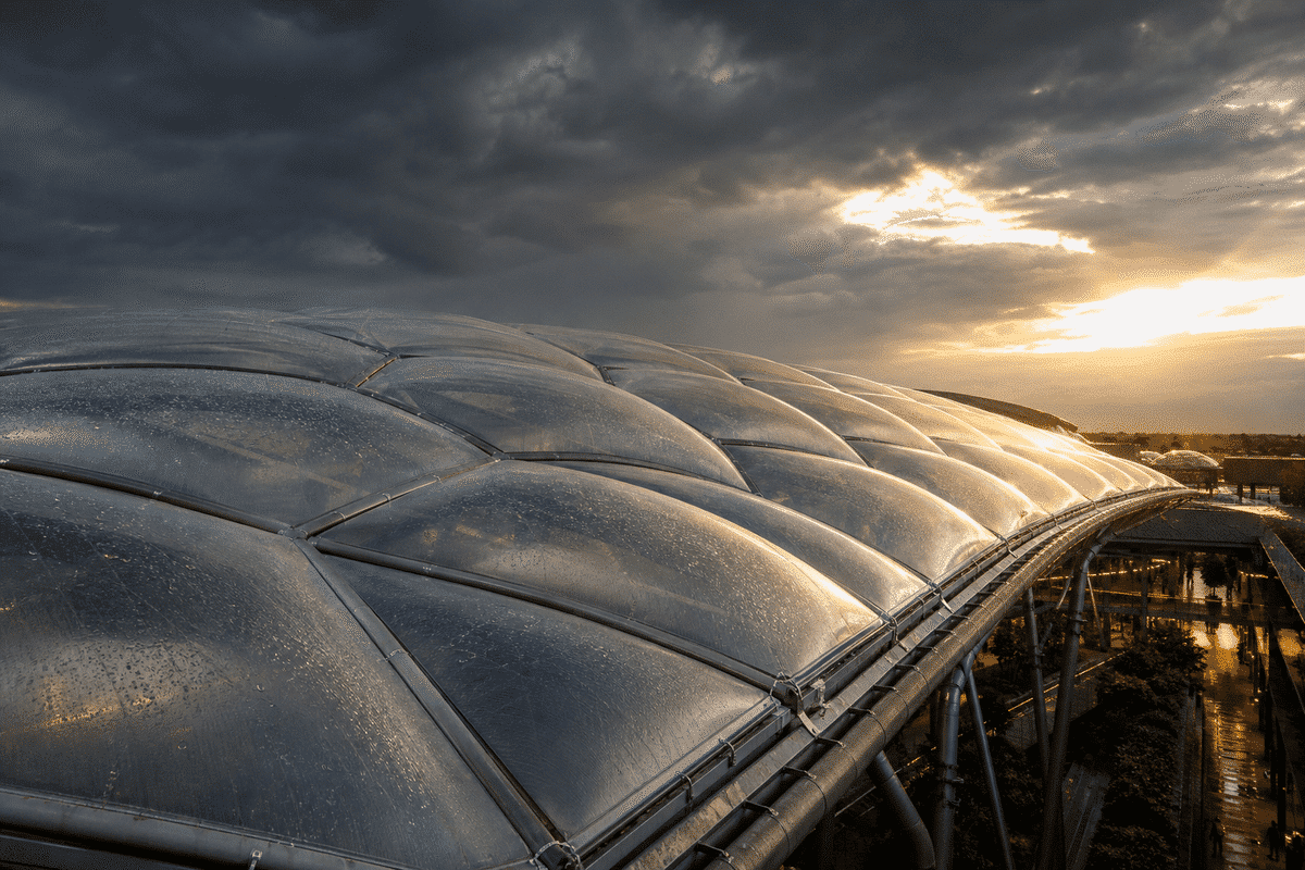 ETFE mall roof under storm lighting and rain