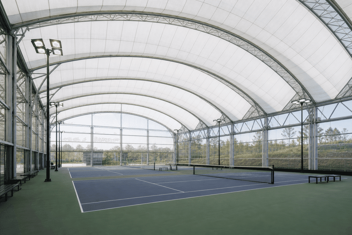 Indoor sports courts under sweeping ETFE roof