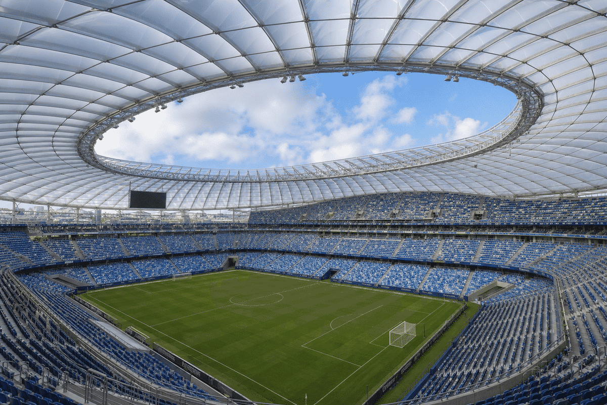 Long-span translucent ETFE roof over a sports stadium seating bowl