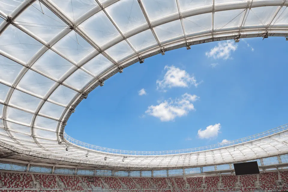 Stadium interior looking up at a daylit ETFE cushion roof — Stadium ETFE Roofing systems