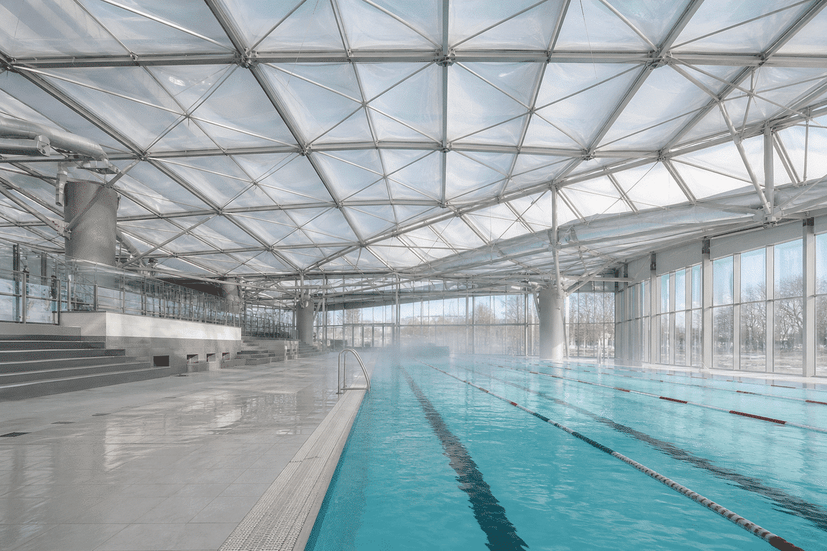 Daylit indoor aquatic centre swimming pool with translucent ETFE roof