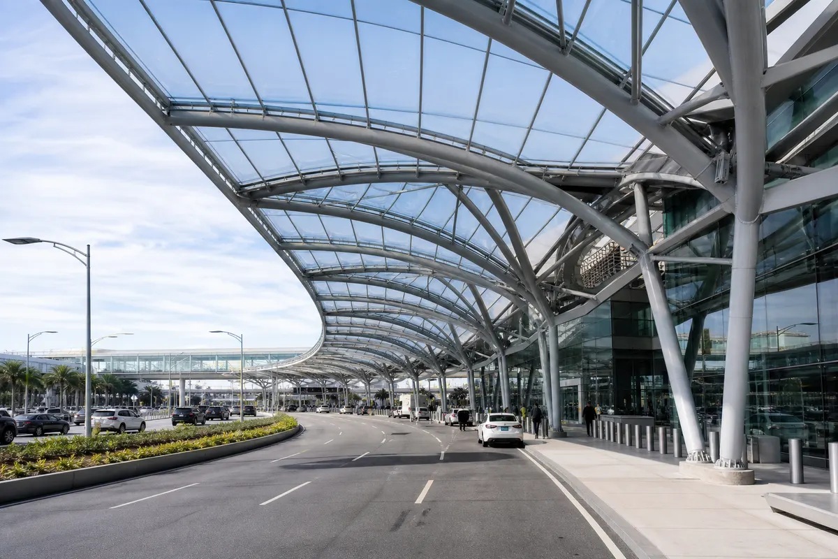 Engineered ETFE canopy structure with drainage detailing over a parking area
