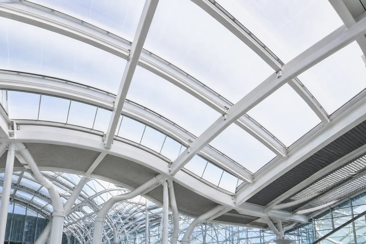 Close-up of a transparent ETFE skylight membrane against a bright sky