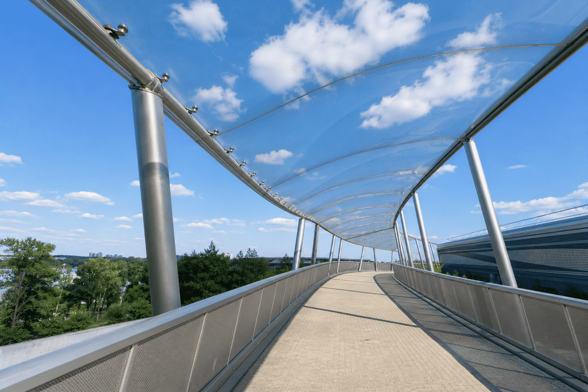 Pedestrian walkway under single-layer ETFE sail canopy