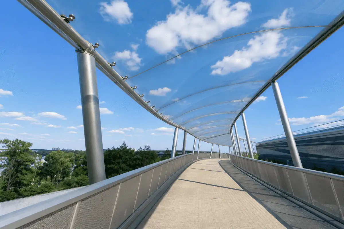 Pedestrian walkway under single-layer ETFE sail canopy — ETFE Single Layer System