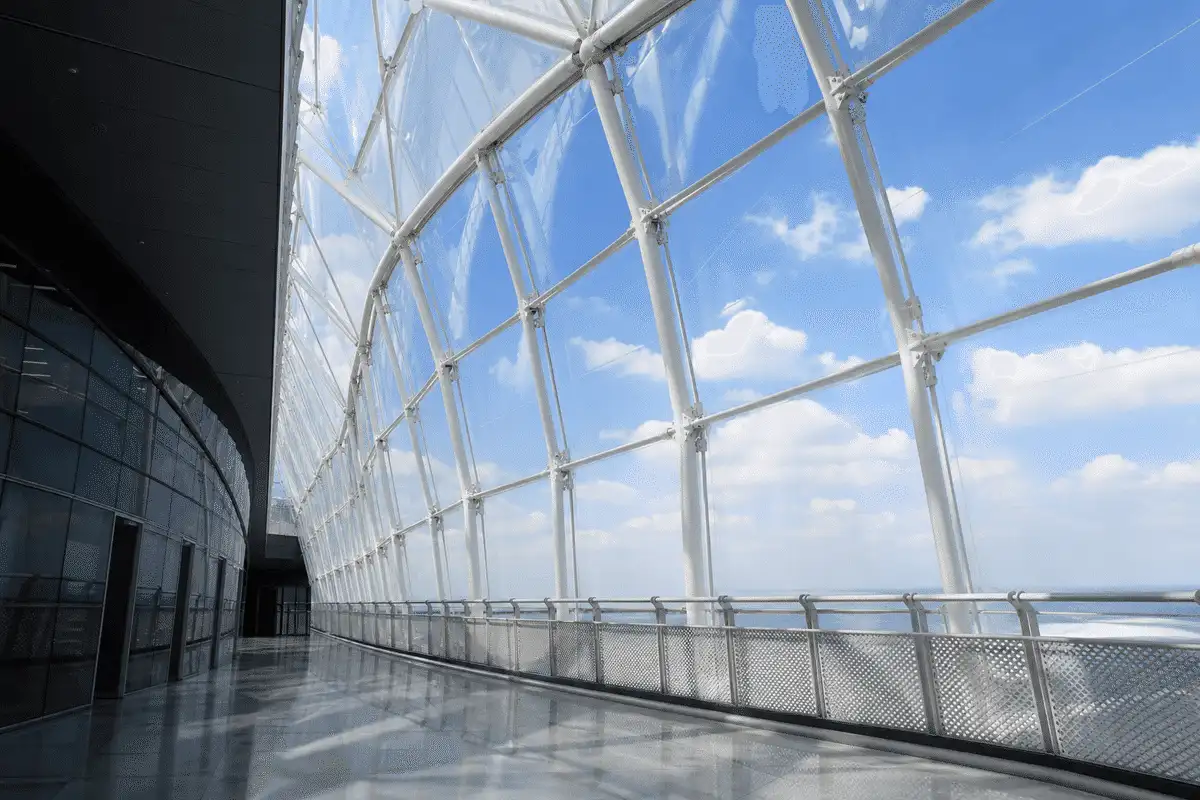 Botanical garden ETFE dome beside glass greenhouse bay — ETFE Vs Glass