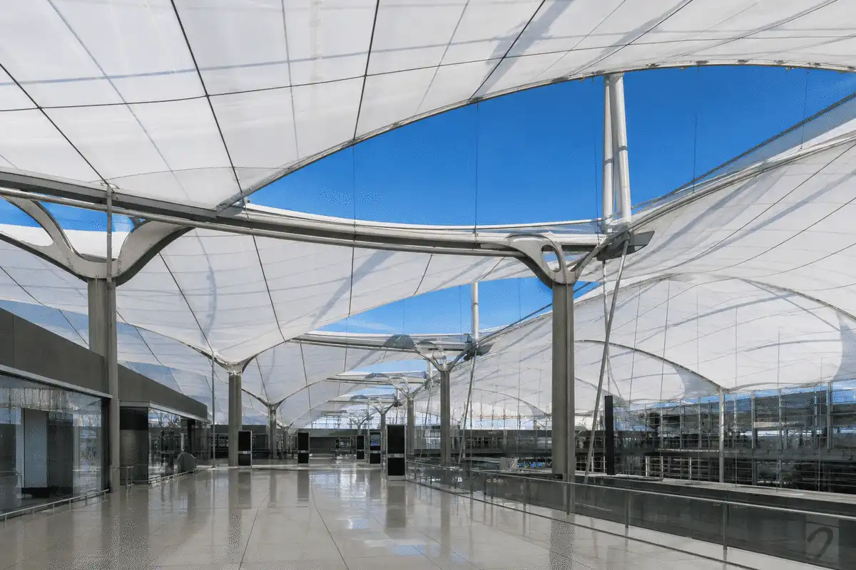 Airport terminal ETFE canopy with daylight and blue sky — ETFE technical guide — ETFE technical guide
